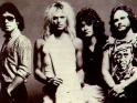 Van Halen, zleva Alex Van Halen, David Lee Roth, Eddie Van Halen, Michael Anthony, cca přelom 70-80. let