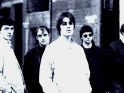 Oasis, na snímku Tony McCarroll, Paul "Bonehead" Arthurs, Liam Gallagher, Noel Gallagher, Paul "Guigsy" McGuigan, 1994